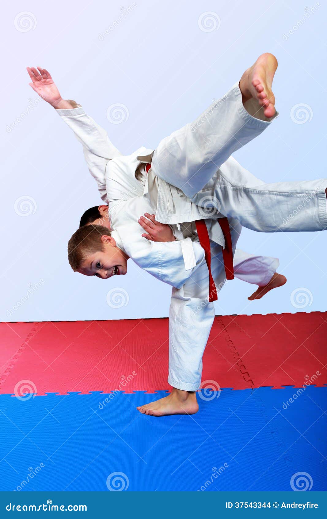 Small Athlete With A White Belt Performs Throw Judo Stock Images