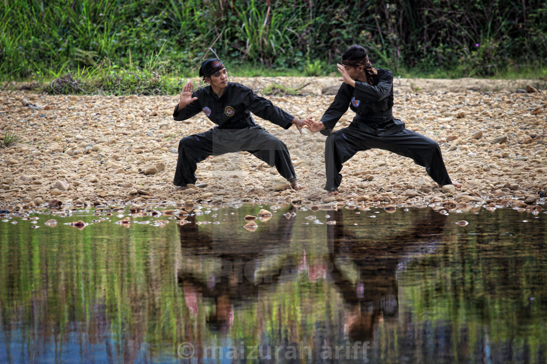 Martial art known as silat by two martial art practitioners - License