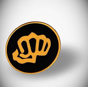 KARATE FIST, GOLD ON BLACK CLOTH PATCH / BADGE - SHUKOKAI, SHITO RYU